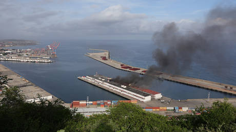 Smoke rises from Port of La Guaira after explosions and low-flying aircraft were heard on January 03, 2026 in La Guaira, Venezuela.