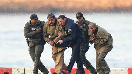 Nicolas Maduro and his wife, Cilia Flores, dragged by US agents, after landing at a Manhattan helipad on January 5.